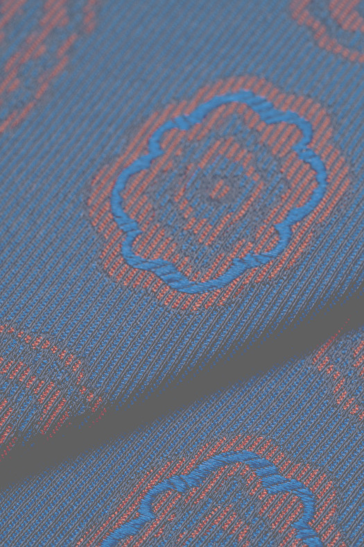 Cravatta jacquard in seta con disegno geometrico deco  